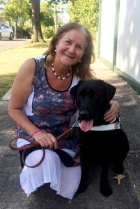 Maribel with black lab dog guide