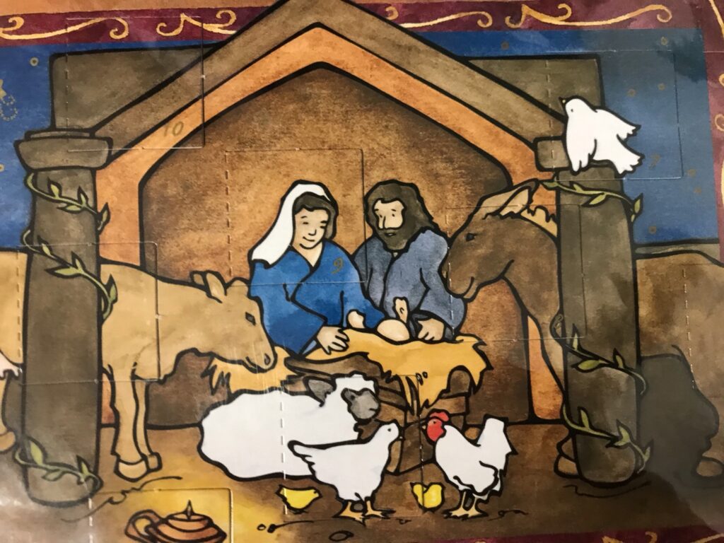 manger scene with cradle, chickens, cows, sheep, horses, Mary and Joseph