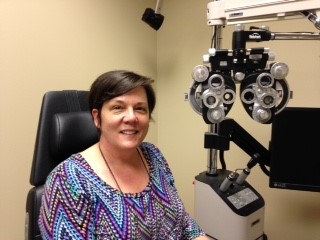 Audrey sitting in examining room of ophthalmologist's office