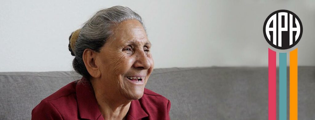 Photo of woman sitting on couch smiling