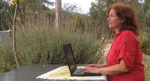 A person sitting outside using a computer

Description automatically generated with medium confidence