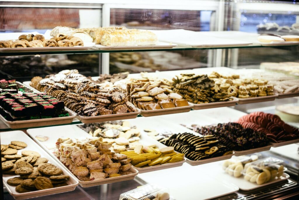 bakery items on shelves in bakery.
Photo by Greta Punch on Unsplash 