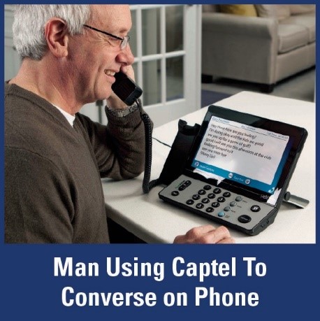 Man Using Captel to Converse on Phone