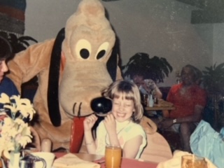 Dayle's daughter with stuffed animal Pluto