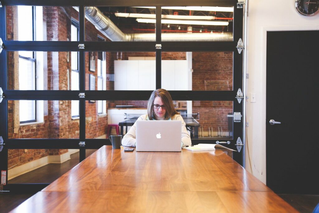 Person at Table Typing on Table